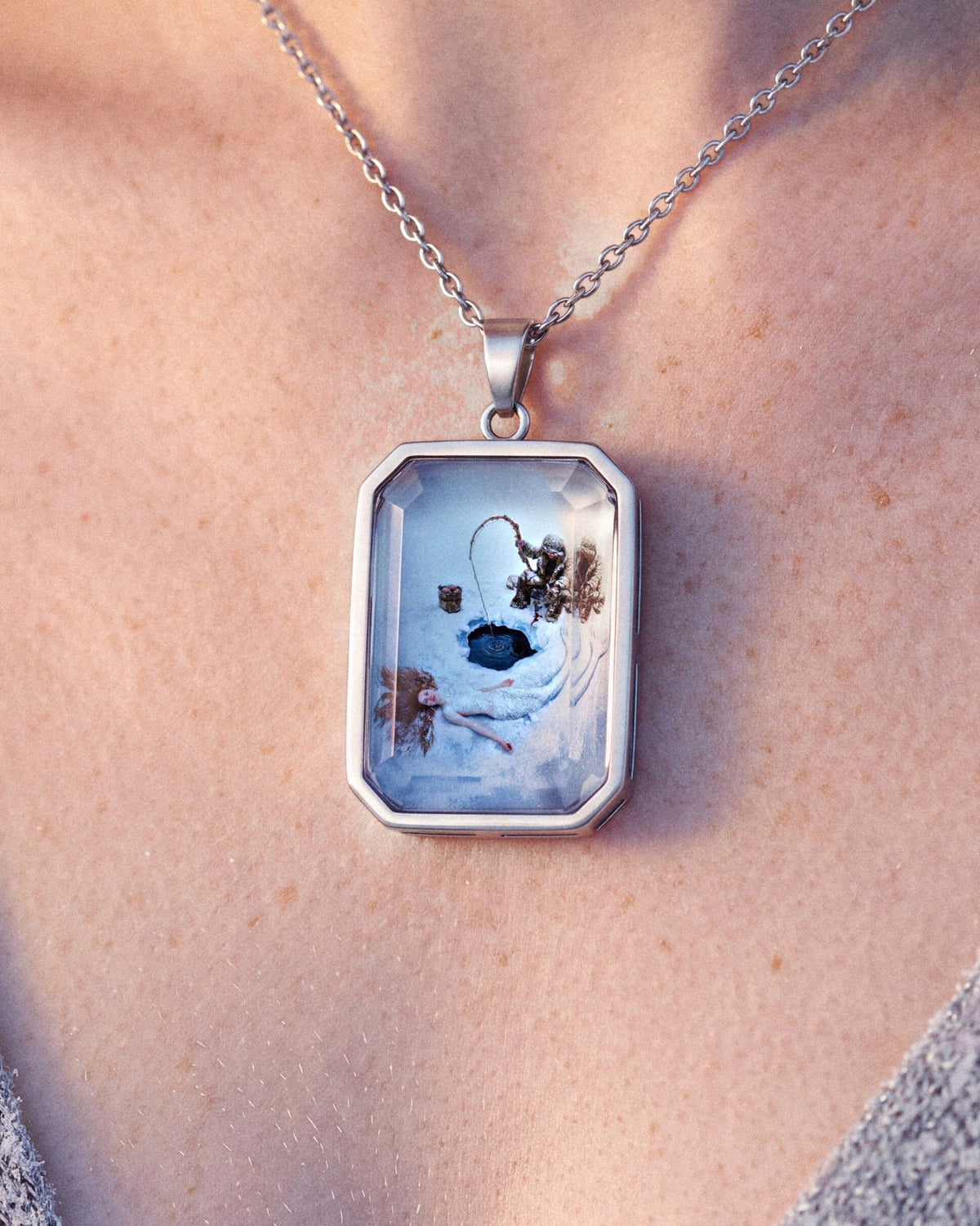 Dreamfisher, the Amulet by Mirrors by Viulet, worn, close, the artwork facing out