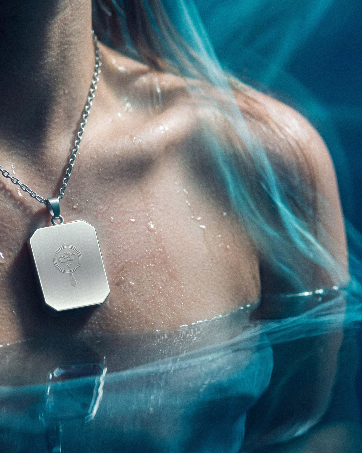 The War Within, the Amulet by Mirrors by Viulet, in the water, wet skin, turned to its back