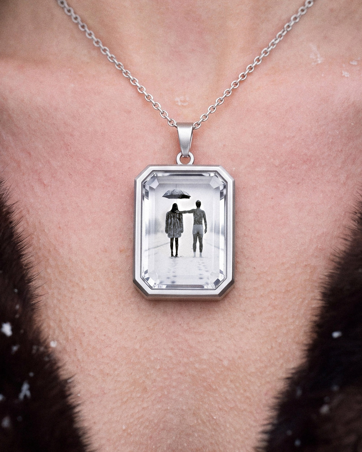 The Winter Between Us, the Amulet by Mirrors by Viulet, worn, close, the artwork facing out