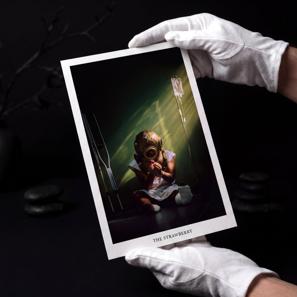 The Strawberry, the signed print, held in gloved hands
